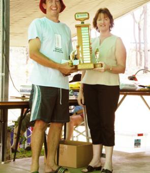 Shaun Manthey of Nanango being presented with the Pioneer Permanent trophy and prize money for heaviest Australian bass by Michelle Lange from the Wondai Branch of Pioneer Permanent.